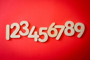 The numbers one through nine on a red background
